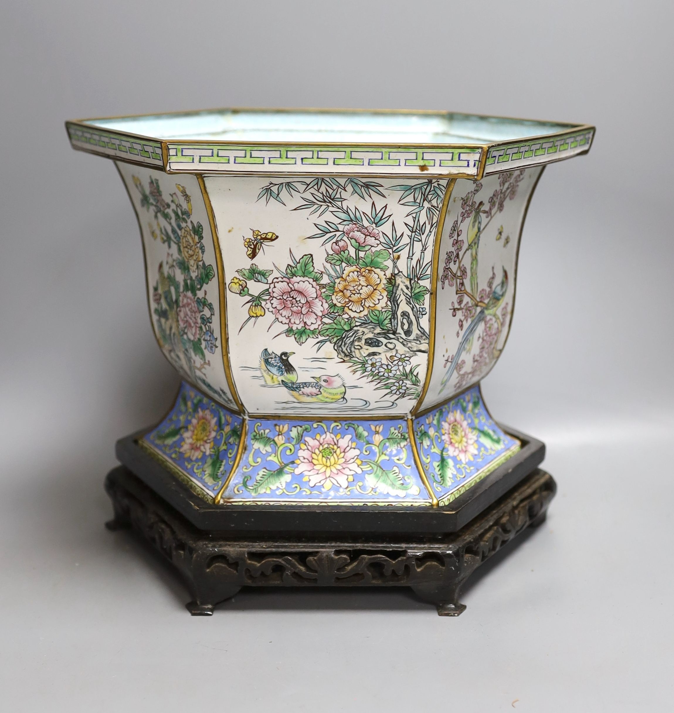 A Chinese Canton enamel jardiniere on hardwood stand, total height 23cm